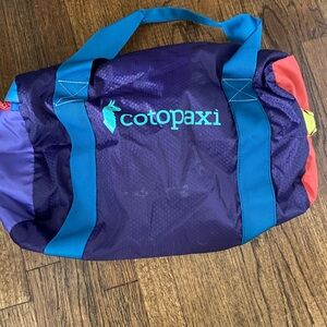 Cotopaxi Multicolor Duffel Bag with Blue Straps